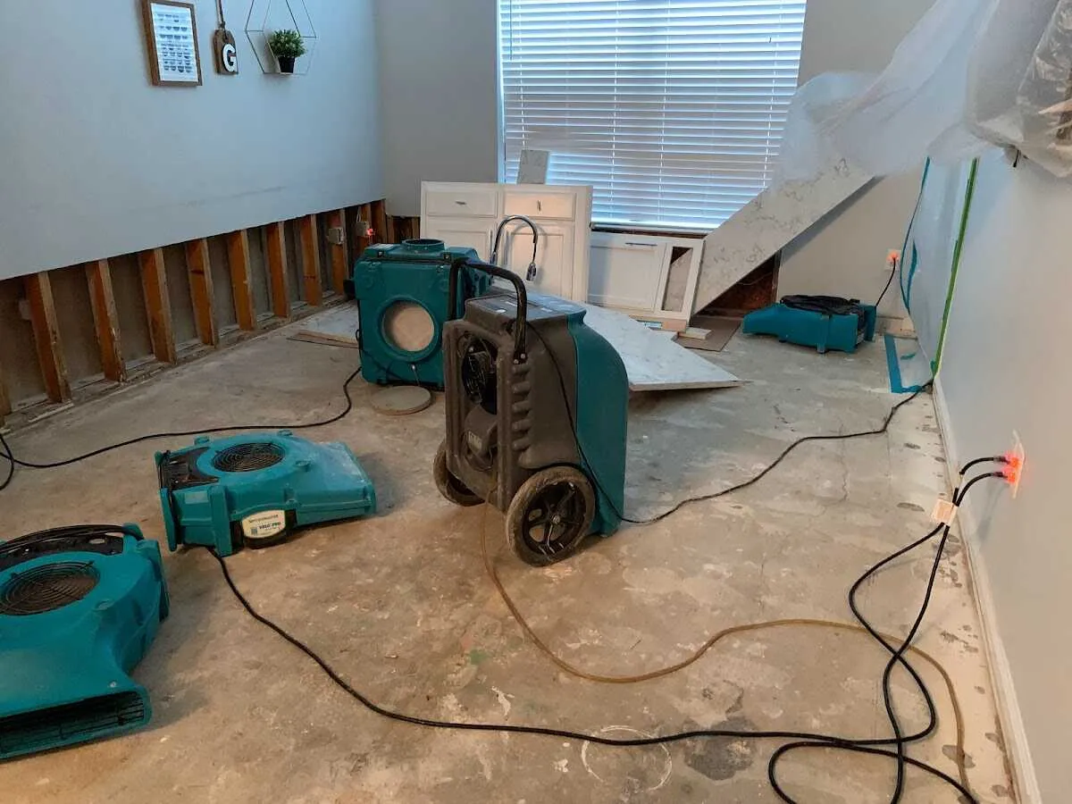 Dehumidifier in flood-cut room for Water Damage Restoration in Thornapple